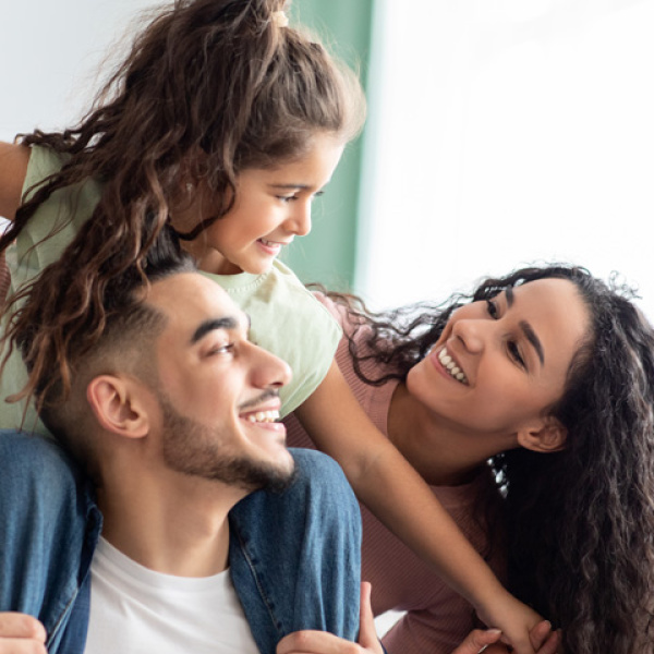 A happy young parents with their daughter.